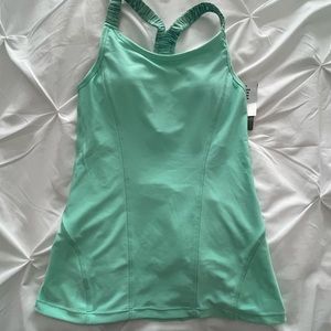 Gorgeous green active top with removable pads- NWT. Size XS
